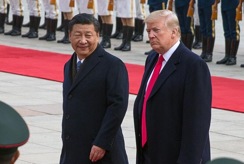 epa07253209 (FILE) - US President Donald J. Trump (R) and Chinese President Xi Jinping (L) review soldiers of the Chinese People's Liberation Army honor guard during a welcome ceremony at the Great Hall of the People in Beijing, China, 09 November 2017 (reissued 29 December 2018). Trump said on Twitter on 29 December 2018 that he had a 'long and very good call' with Chinese President Xi Jinping on a possible trade deal between the United States and China.  EPA/ROMAN PILIPEY