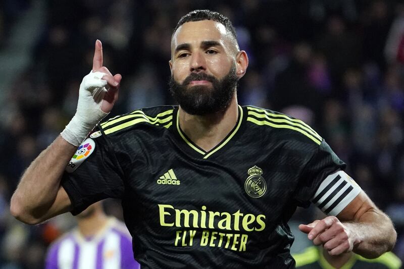 Real Madrid's French forward Karim Benzema celebrates scoring the opening goal from the penalty spot during the Spanish League football match between Real Valladolid FC and Real Madrid CF at the Jose Zorilla stadium in Valladolid on December 30, 2022.  (Photo by CESAR MANSO  /  AFP)