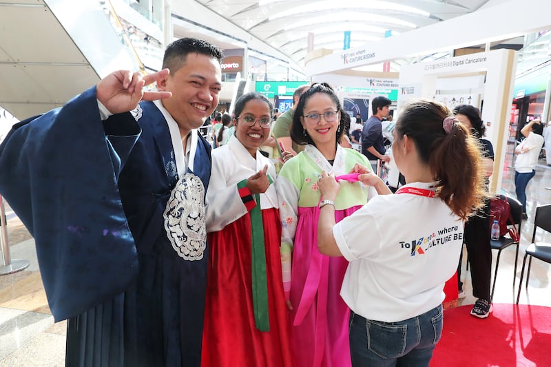 Visitors try on hanbok at the K-Culture event 