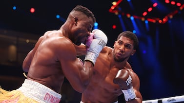 RIYADH, SAUDI ARABIA - MARCH 08: Anthony Joshua punches Francis Ngannou during the Heavyweight fight between Anthony Joshua and Francis Ngannou on the Knockout Chaos boxing card at the Kingdom Arena on March 08, 2024 in Riyadh, Saudi Arabia. (Photo by Richard Pelham / Getty Images)