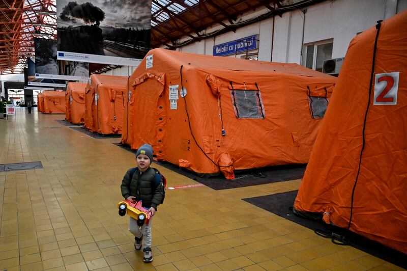 Tents set up for Ukrainian refugees inside a train station in Bucharest, Romania. AFP