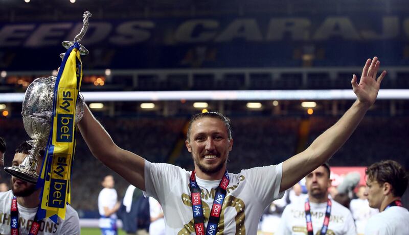 Leeds United's Luke Ayling with the Championship trophy. PA
