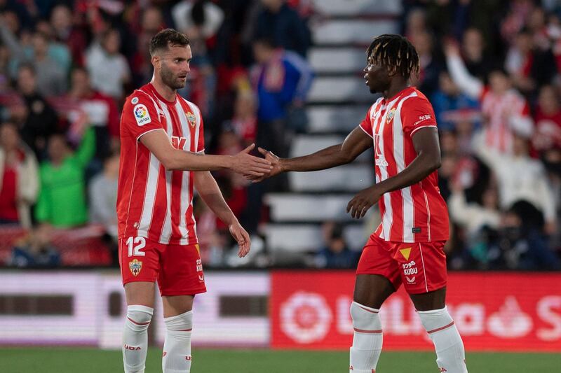 Almeria's Malian forward El Bilal Toure (R) celebrates with Almeria's Brazilian forward Leo Baptistao after scoring his team's first goal during the Spanish League football match between UD Almeria and FC Barcelona at the Municipal Stadium of the Mediterranean Games in Almeria, on February 26, 2023.  (Photo by JORGE GUERRERO  /  AFP)