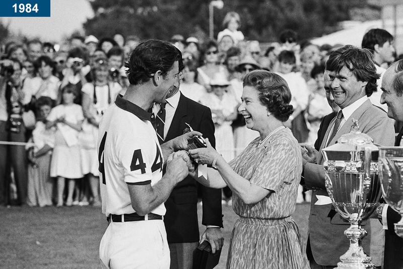 1984: Prince Charles is presented with an award by his mother, after a polo match at Smiths Lawn in Windsor.