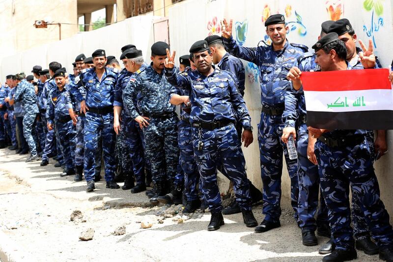 epa06725000 Members of the security forces stand in line to cast their votes during the special voting day for the Iraqi legislative election at a polling station in Baghdad, Iraq, 10 May 2018. About One million member of the Iraqi security forces in Iraq vote for the legislative election during a special voting day ahead of the public vote in the Iraqi legislative elections on 12 May 2018.  EPA/ALI ABBAS