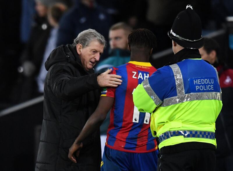 Soccer Football - Premier League - Swansea City vs Crystal Palace - Liberty Stadium, Swansea, Britain - December 23, 2017   Crystal Palace manager Roy Hodgson and Wilfried Zaha after the match   REUTERS/Dylan Martinez    EDITORIAL USE ONLY. No use with unauthorized audio, video, data, fixture lists, club/league logos or "live" services. Online in-match use limited to 75 images, no video emulation. No use in betting, games or single club/league/player publications.  Please contact your account representative for further details.