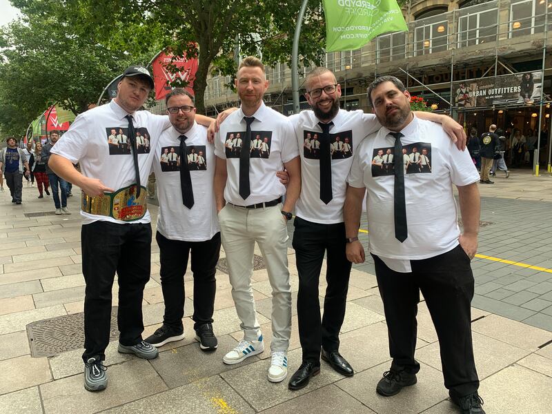 Sean Davies, second from the right, from Swansea, and his friends dress up as members of the former Right to Censor stable from the early 2000s.