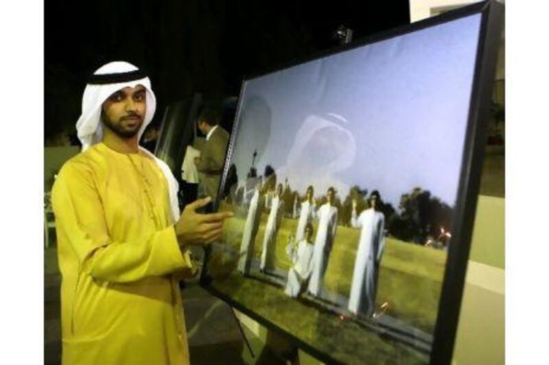 Hamdan Buti Al Shamisi with his submitted photo at the Tashkeel Art Gallery in Dubai.