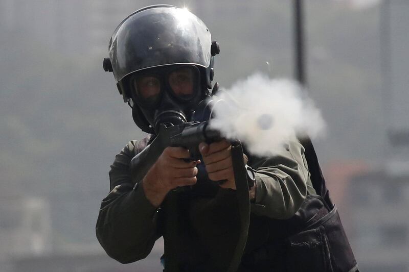 A member of the security forces fires tear gas during clashes at a protest against Venezuelan President Nicolas Maduro's government in Caracas, Venezuela. Reuters / Carlos Garcia Rawlins