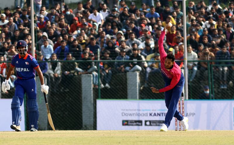 Zahoor Khan of UAE bowls in front of a packed crowd at TU Cricket Stadium