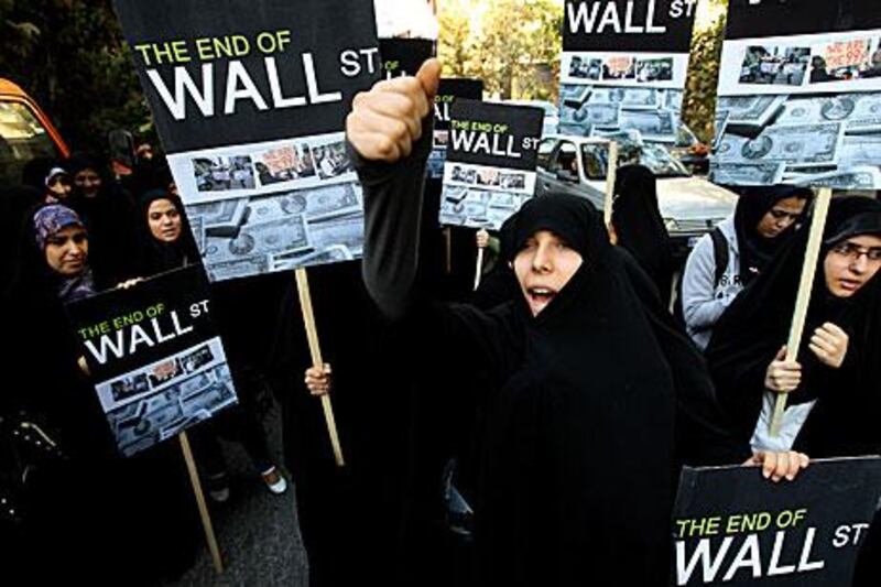 Iranian women show support for the Occupy Wall Street movement outside the Swiss Embassy in Tehran in October.