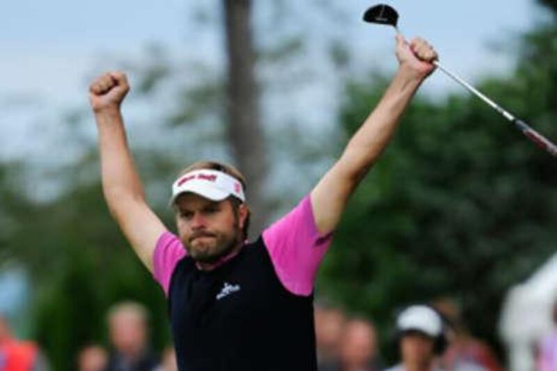Jose Manuel Lara celebrates after sinking a putt on the 18th hole during the final round of the Austrian Open.