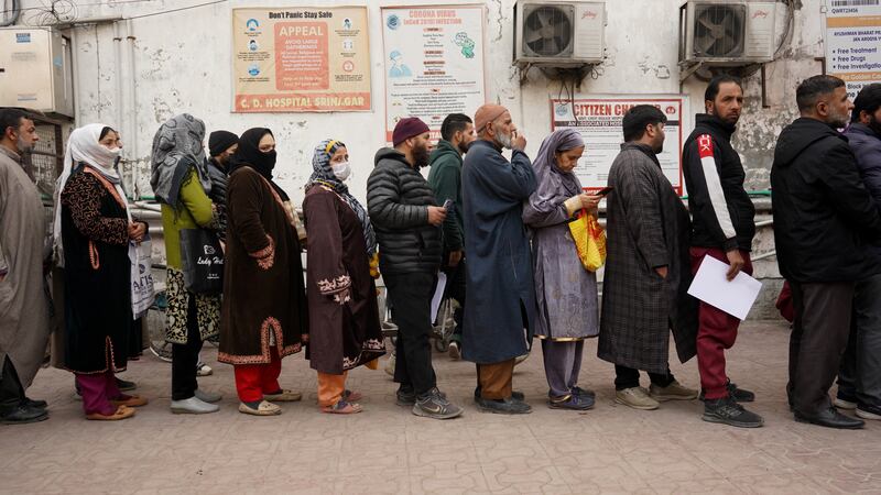 Queues at a hospital in Srinagar as flu, fever, and coughs spread in the prolonged spell of dry weather. Wasim Nabi for The National
