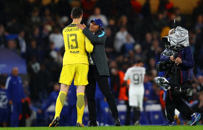 Thibaut Courtois and Antonio Conte celebrate Chelsea's 6-0 win over Qarabag in the Uefa Champions League on Tuesday night. Clive Rose / Getty Images