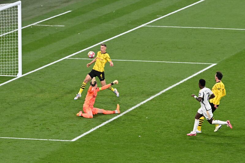 Vinicius Junior scores Real Madrid's second goal past Dortmund goalkeeper Gregor Kobel. AFP