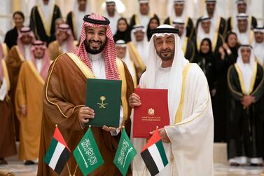 ABU DHABI, UNITED ARAB EMIRATES - November 27, 2019: HH Sheikh Mohamed bin Zayed Al Nahyan, Crown Prince of Abu Dhabi and Deputy Supreme Commander of the UAE Armed Forces (R) and HRH Prince Mohamed bin Salman bin Abdulaziz, Crown Prince, Deputy Prime Minister and Minister of Defence of Saudi Arabia (L), stand for a photograph after signing the minutes of the Saudi-Emirati Coordination Council during a state visit, at Qasr Al Watan. ( Ryan Carter for the Ministry of Presidential Affairs ) ---