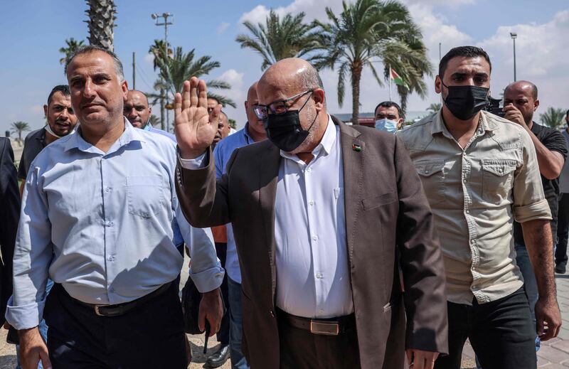 Hamas official Issam Al Daalis, centre, at the Rafah border crossing with Egypt in Gaza earlier this week. A delegation from Gaza went to Egypt for indirect talks with Israeli. Photo: AFP