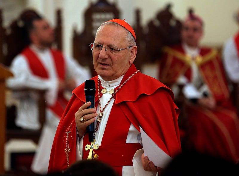 Cardinal Louis Raphael I Sako addresses the faithful during the Palm Sunday service at Mar Youssif Church in Baghdad, Iraq, Sunday, April 14, 2019. (AP Photo/Hadi Mizban)