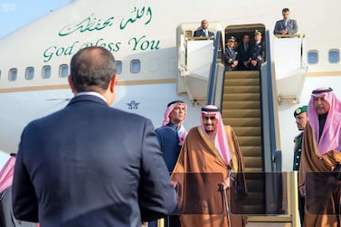 Egyptian President Abdel Fatah El Sisi waits to greet Saudi Arabia's King Salman as he arrives for the Arab-EU summit on February 23, 2019. Saudi Press Agency
