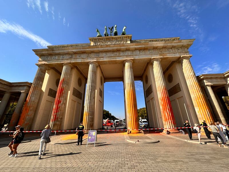 Orange paint sprayed on the Brandenburg Gate in Berlin by the Last Generation protest group. AP
