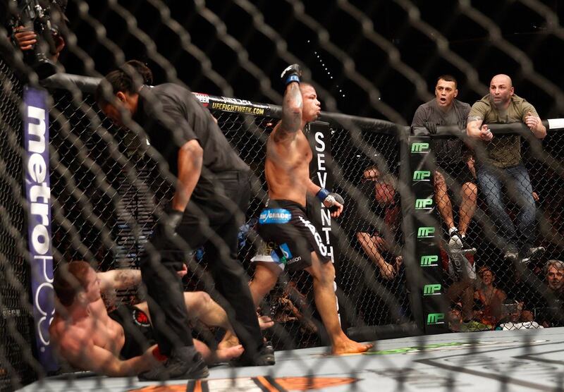 Thiago Alves celebrates after his second-round TKO win over Jordan Mein in their welterweight fight at UFC 183 on Saturday. Steve Marcus / Getty Images / AFP