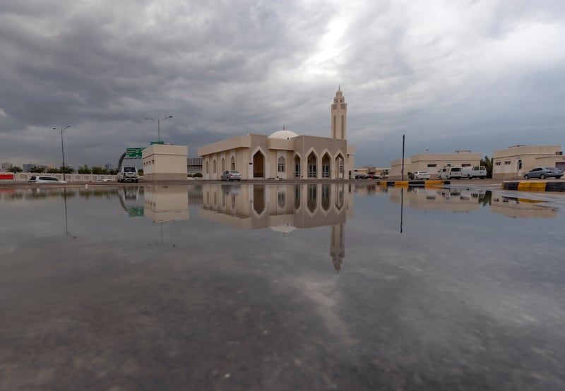 Dark skies loom over flooding in Sharjah. Chris Whiteoak / The National