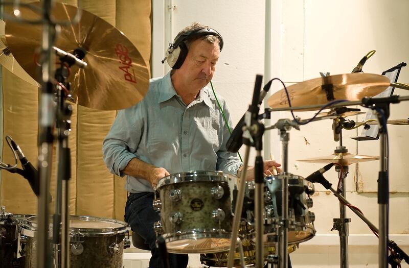 Pink Floyd drummer Nick Mason takes part in a charity recording of a Children in Need album at Abbey Road studios in west London on September 7, 2009. The group including Sir Terry Wogan, former Rolling Stone Bill Wyman, singer Midge Ure and many others will be recording a version of the Beatles' classic "All You Need Is Love" for the forthcoming "Bandaged Together" album. AFP PHOTO/Leon Neal (Photo by LEON NEAL / AFP)