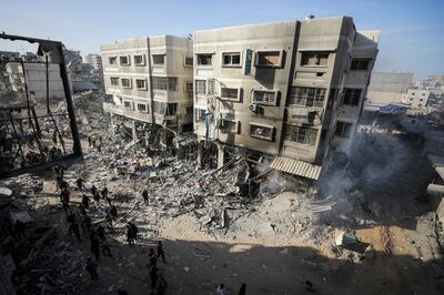 Palestinians inspect the damage around Gaza city's Al Shifa Hospital following a two-week Israeli operation. Reuters