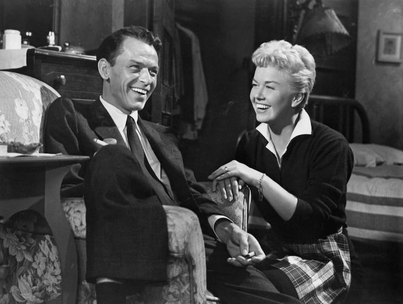 Frank Sinatra and Doris Day sharing a laugh in a scene from the film 'Young At Heart', 1954. (Photo by Warner Brothers/Getty Images)