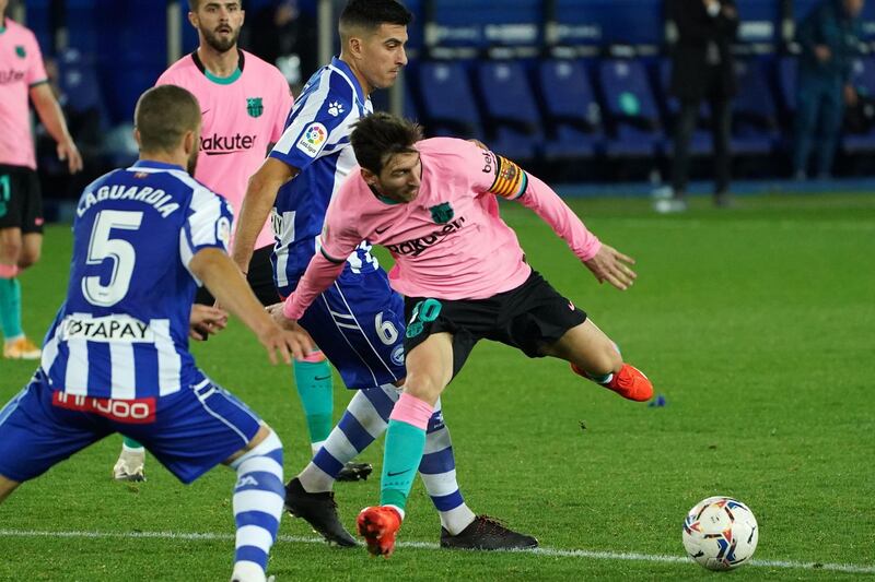 Messi battles with Alaves midfielder Rodrigo Battaglia. AFP