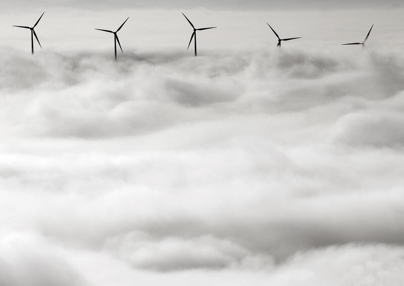 Wind turbines stand out from the dense blanket of fog covering Pamplona, northern Spain. EPA