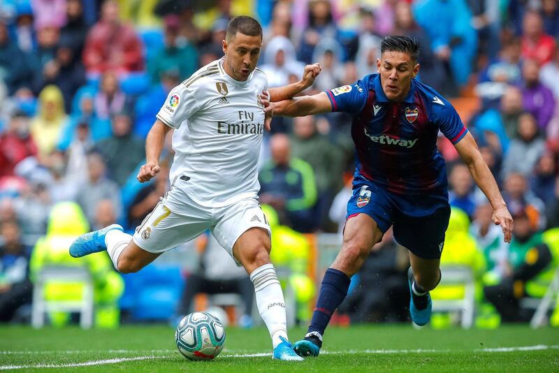 Real Madrid's Eden Hazard in action against Levante's Oscar Duarte. EPA