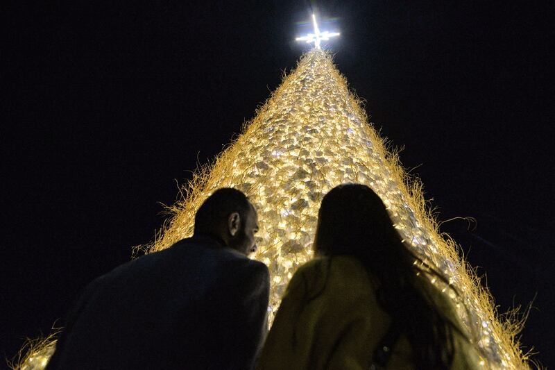 People view the illuminated Christmas tree at Qaraqosh, often referred to as Iraq’s Christian capital. AFP