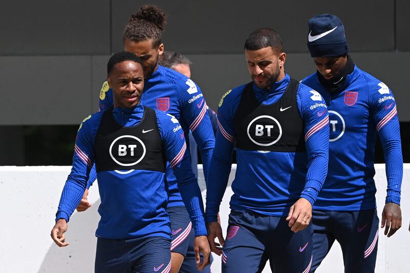 Raheem Sterling, Kyle Walker and Marcus Rashford attend an England training session at St George's Park.