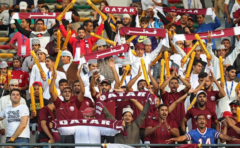 Qatar supporters cheer ahead of the AFC Asian Cup final football match between Japan and Qatar in Abu Dhabi. Karim Sahib / AFP