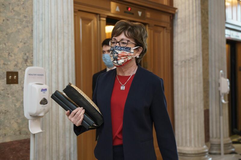 Sen. Susan Collins, arrives for votes during a rare weekend session to advance the confirmation of Judge Amy Coney Barrett to the Supreme Court, at the Capitol in Washington. AP Photo