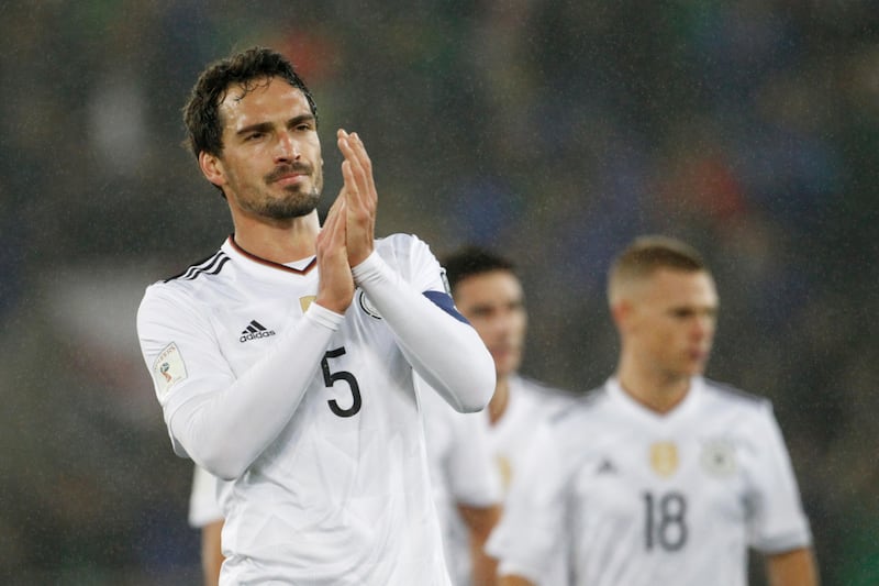 Germany's Mats Hummels applauds his side's supporters after the World Cup Group C qualifying soccer match between Northern Ireland and Germany at Windsor Park in Belfast, Northern Ireland, Thursday, Oct. 5, 2017. (AP Photo/Peter Morrison)