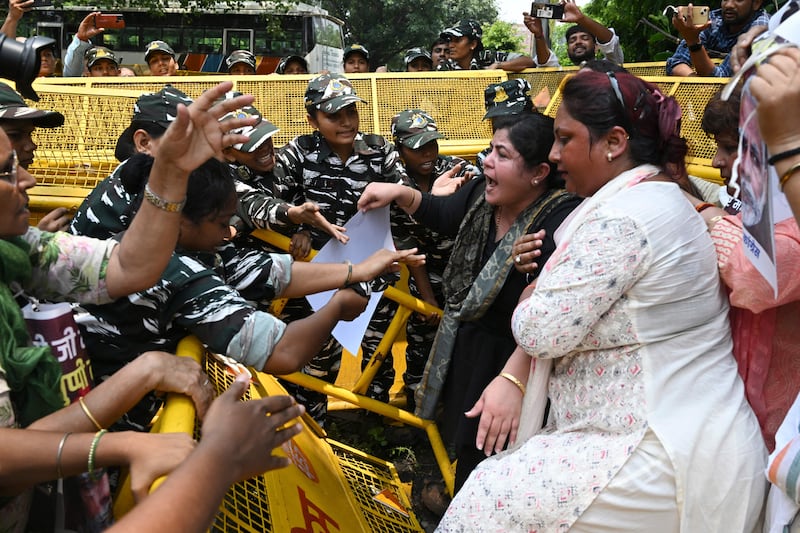 All India Mahila Congress members confront police in New Delhi during a protest over sexual violence against women in India's north-eastern state of Manipur. AFP