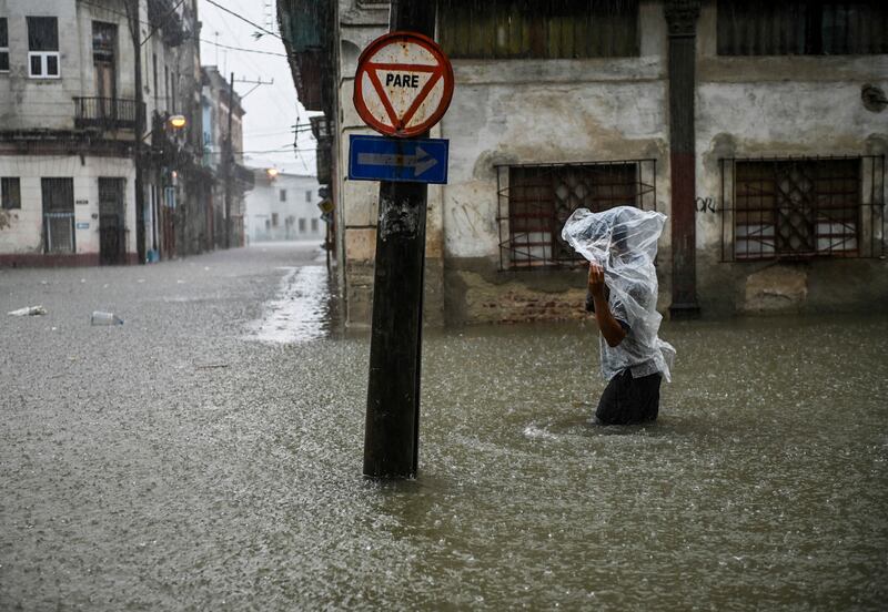 A man wades along a flooded street of Havana. The remnant of Hurricane Agatha is causing intense and persistent rains this Friday in the western and central provinces of Cuba. AFP