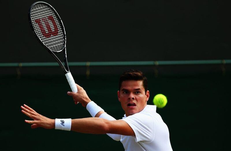 Milos Raonic returns a shot against Kei Nishikori on Tuesday in their Wimbledon fourth-round match at the All England Club in London, England. Clive Brunskill / Getty Images / July 1, 2014