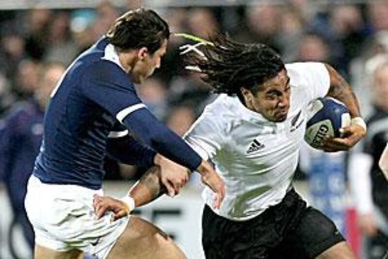 New Zealand centre Ma'a Nonu, right, fends off  the challenge of France's Francois Trinh-Duc during their 39-12 win in Marseille on Saturday.