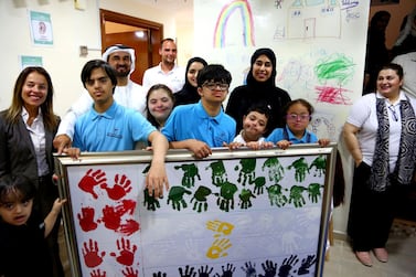 Hessa Buhumaid, Minister of Community Development, (second right, back) inaugurates Dubai Down Syndrome Centre. Courtesy Ministry of Community Development