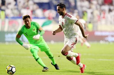 Dubai, United Arab Emirates - October 10, 2019: UAE's Ali Mabkhout scores his hatrick during the Qatar 2022 world cup qualifier between The UAE and Indonesia. Thursday 10th of October. Al Maktoum Stadium, Dubai. Chris Whiteoak / The National