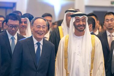 BEIJING, CHINA - July 23, 2019: HH Sheikh Mohamed bin Zayed Al Nahyan, Crown Prince of Abu Dhabi and Deputy Supreme Commander of the UAE Armed Forces (R), attends a reception held by the UAE Embassy, marking the 35th anniversary of the establishment of diplomatic ties between UAE and China. Seen with HE Wang Qishan, Vice President of China (L). ( Hamad Al Mansoori for Ministry of Presidential Affairs ) ---