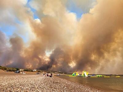 Clouds of smoke from a forest fire rise on the island of Rhodes. AP