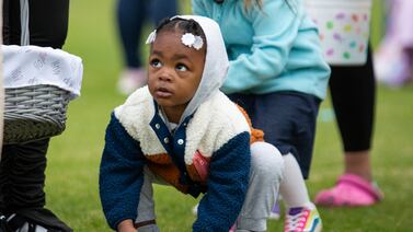 A child collects Easter eggs during an event to mark the Christian festival in the US city of Kentucky. AP