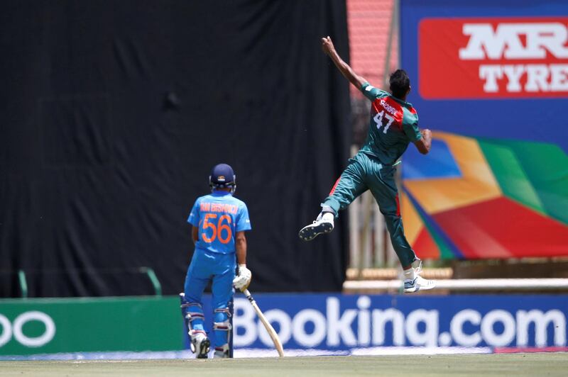 Bangladesh's Shoriful Islam (R) celebrates after the dismissal of India's Ravi Bishnoi (L) during the ICC Under-19 World Cup cricket finals between India and Bangladesh at the Senwes Park, in Potchefstroom, on February 9, 2020. (Photo by MICHELE SPATARI / AFP)