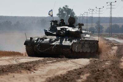 An Israeli tank operates along the Gaza border on Monday. Reuters