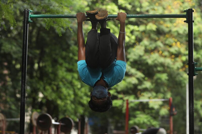 A boy exercises at a park after a few restrictions were relaxed during a lockdown in Mumbai. Reuters