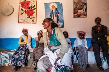 A woman cries in her home as a group of relatives look on in the village of Dengolat, north of Mekele, the capital of Tigray, where the UN says widespread murder, rape and looting are taking place. AFP